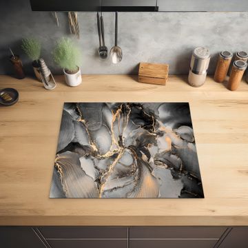 Herdabdeckplatte - Geologisches Gold auf Marmor